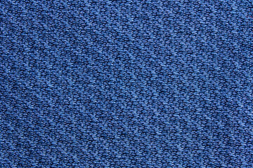 Close up of textured blue fabric with detailed weave pattern for background or design inspiration.