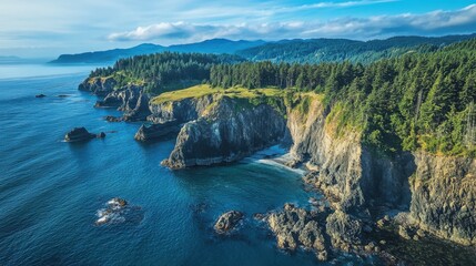 Rugged coastline showcases natural beauty and vibrant green landscapes beneath a serene blue sky in the late afternoon light
