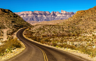 Canyon desert road to mountains