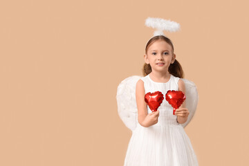Cute little girl dressed as Cupid with air balloons in shape of heart on brown background. Valentine's Day celebration
