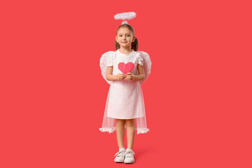 Cute little girl dressed as Cupid with heart made of paper on red background. Valentine's Day...