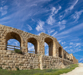 Roman ruins (against the background of a beautiful sky with clouds) in the Jordanian city of Jerash (Gerasa of Antiquity), capital and largest city of Jerash Governorate, Jordan