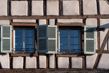 Close up of a window with shutters of a half timbered houses Colmar France