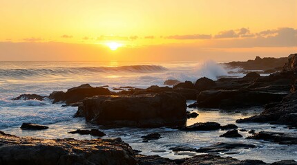 scenic coastal view during sunset with the sun near the horizon, casting a warm glow over the scene. The rocky shore is partially submerged with waves crashing against the rocks.