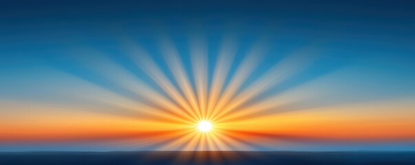 Obraz premium A serene sunrise with vibrant rays radiating across a clear blue sky, casting warm hues over the horizon.