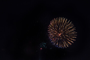 Fireworks on the dark sky background at festival.