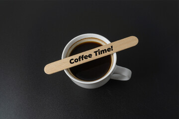 A cup of coffee with a word Coffee Time on black background
