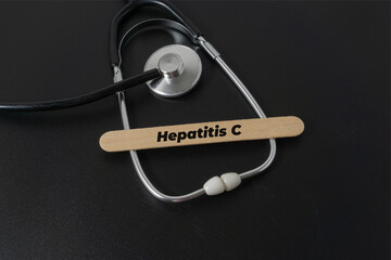 Medical concept with a word Hepatitis C on black background