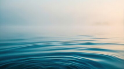 Body of water with a foggy sky in the background