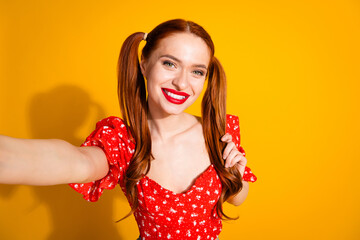 Photo portrait of lovely young lady selfie photo touch hair dressed stylish red garment isolated on yellow color background