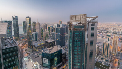 The skyline of the West Bay area from top in Doha night to day timelapse, Qatar.