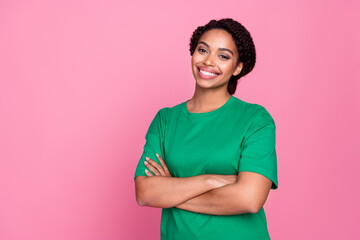 Photo portrait of attractive young woman crossed hands confident dressed stylish green clothes isolated on pink color background