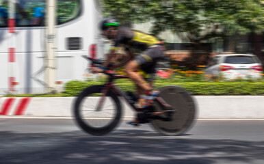 Fototapeta premium Blurred cyclist in motion