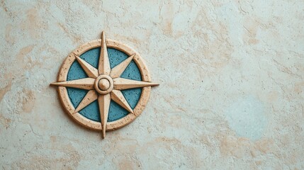 A decorative compass rose mounted on a textured wall, symbolizing navigation and adventure.