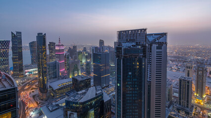 The skyline of the West Bay area from top in Doha day to night timelapse, Qatar.