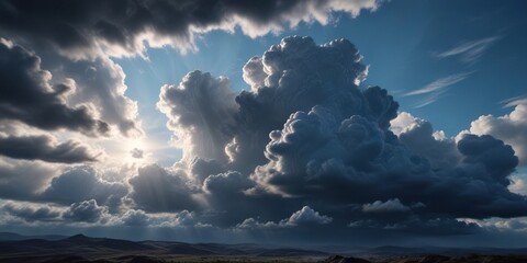 Obraz premium Thick layers of dark clouds create a vast shade in the blue sky, shaded landscape, shadowy veil
