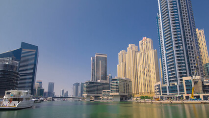 Dubai Marina skyscrapers. View from embankment timelapse hyperlapse