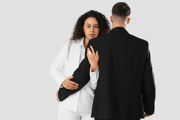 Beautiful young couple hugging on white background. Yin Yang concept