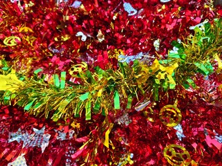 Happy new year background of shiny garlands of merry Christmas multicolored tinsel close-up