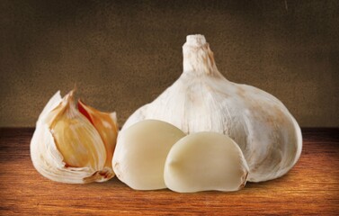 Garlic cloves on wooden table.