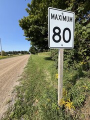 Rb-1 &middot; Maximum 80 sign with a dirt road on the background