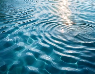 Close-up of gentle ripples on the surface of clear blue water, reflecting soft light patterns. The minimalistic composition emphasizes tranquility and purity.