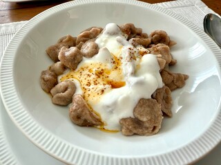 manti turkish ravioli with yogurt or yoghurt