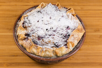 Baked sweet cottage cheese casserole in flat bread in bowl