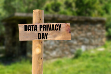 Data privacy day message written on wooden sign with blurry nature background. Conceptual data privacy day symbol. Copy space.