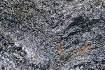 rough granite texture background. Gray black boulder rock