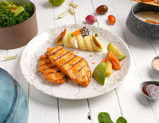 Tender, golden grilled chicken steak  and fresh seasoning. Ideal for healthy, delicious meals , With mashed potatoes, zucchini and carrots