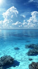 Obraz premium Sunlit Ocean, Clouds, and Underwater Rocks: A Tranquil Seascape