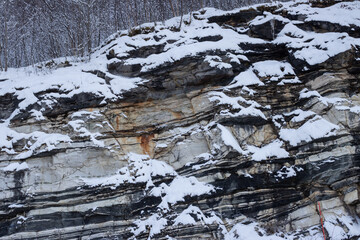 Texture of a stone wall with snow, Norway