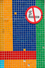 Colourful wall with no smoking sign