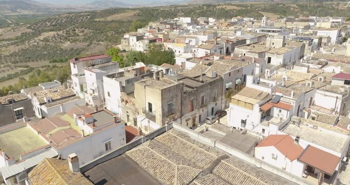 Aerial view of houses, apartments and buildings located in the historic center of the town of Bernalda, in the province of Matera, Basilicata, Italy. It is a traditional Italian village.