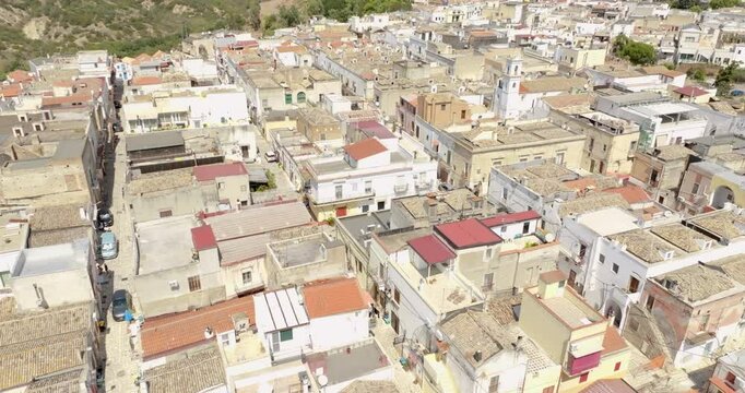Aerial view of houses, apartments and buildings located in the historic center of the town of Bernalda, in the province of Matera, Basilicata, Italy. It is a traditional Italian village.
