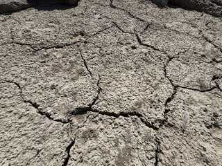 Dry and cracked mud soil, sandy soil section of dry soil drought. Cracked earth texture. Dry...