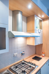 Stylish and sunny kitchen interior with accessories and table. Design space of a Bed and Breakfast