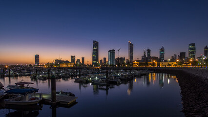 Naklejka premium Yachts and boats at the Sharq Marina night to day timelapse in Kuwait. Kuwait City, Middle East