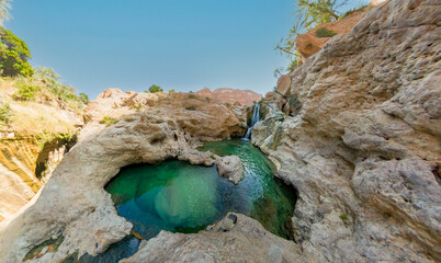 Extreme wide angle photo of Wadi Tiwi pool  oasis in Oman.