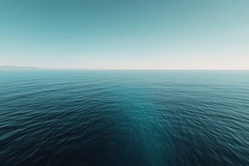 Fototapeta premium Endless ocean stretches under a vast clear sky, evoking tranquility and the boundless spirit of adventure.