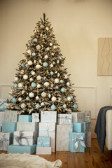 New Year's interior in the house. New Year tree with balls and gifts.