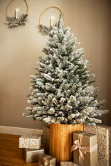 Christmas tree decorated with snow. living room.