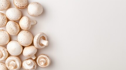 Fresh champignon mushrooms on white background, overhead arrangement, minimalistic style, healthy food concept, copy space


