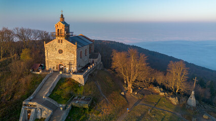 Church on Mount Ślęża at sunrise, bird's eye view, Lower Silesia, Poland.