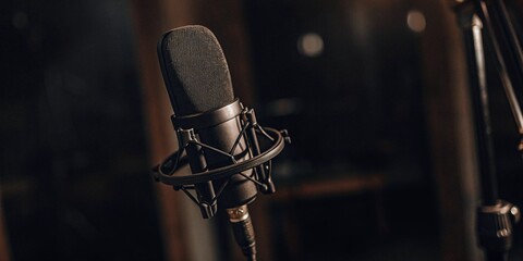 Microphone in a studio, theme of voice record and podcast. 