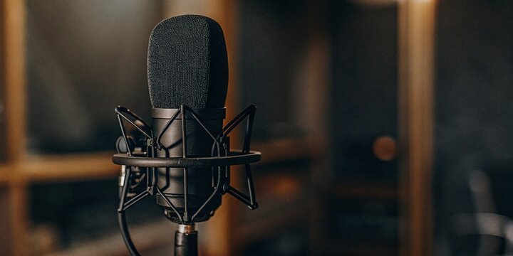 Microphone in a studio, theme of voice record and podcast. 