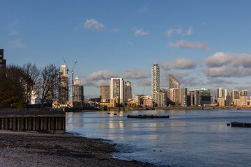 London, UK – December 3, 2024, View from the other side of the Thames, from Canary Wharf at West India Docks, with skyscrapers.