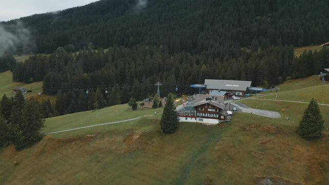 House Near Ski Lift Station On Mountains In Switzerland