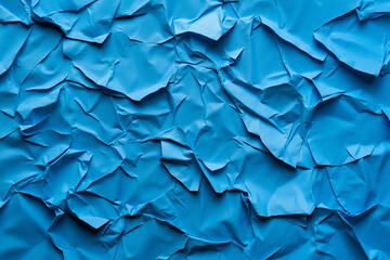 Fototapeta premium A close up of a blue crumpled paper background